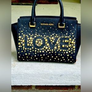 Michael Kors black and gold LOVE handbag